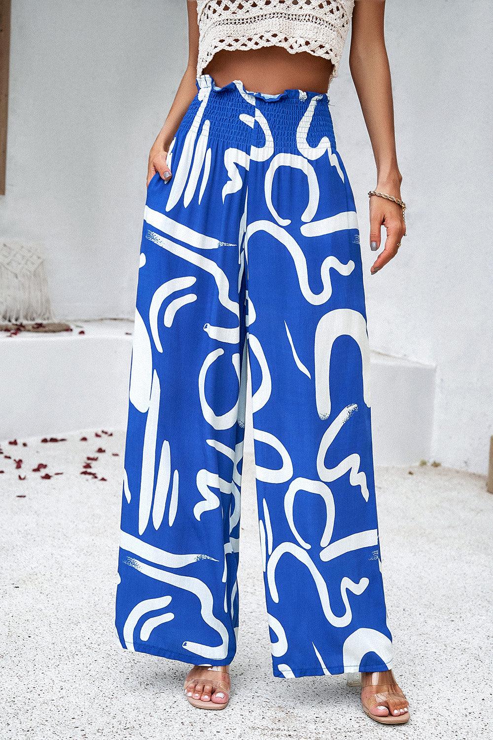 Pantalones anchos con bolsillos y estampado fruncido