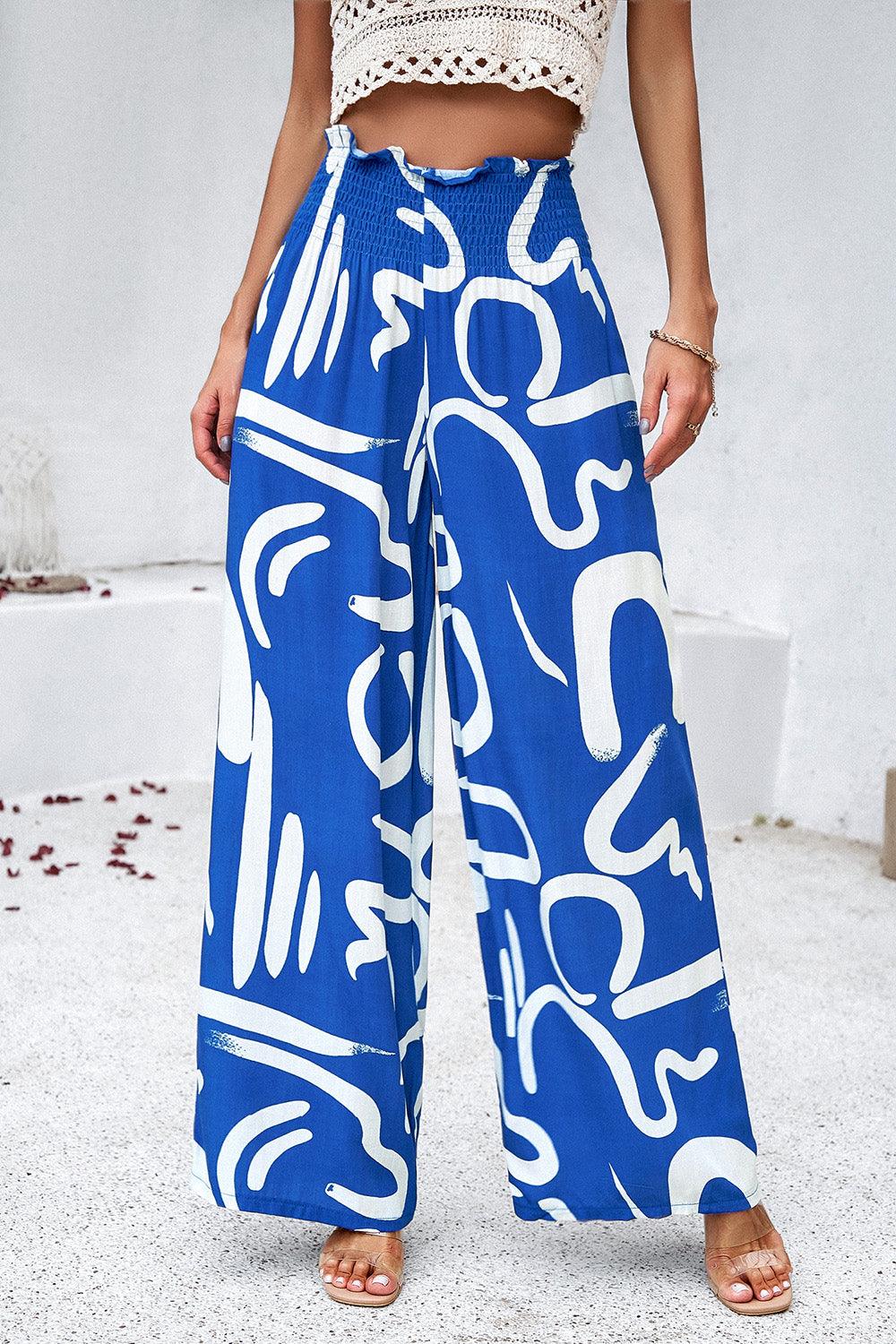 Pantalones anchos con bolsillos y estampado fruncido