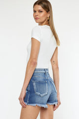 Pantalones cortos de mezclilla con dobladillo sin rematar y tiro alto con bragueta abotonada de Kancan