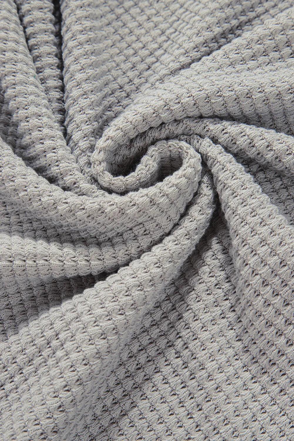 Blusa de manga larga con cuello en V y bloques de color