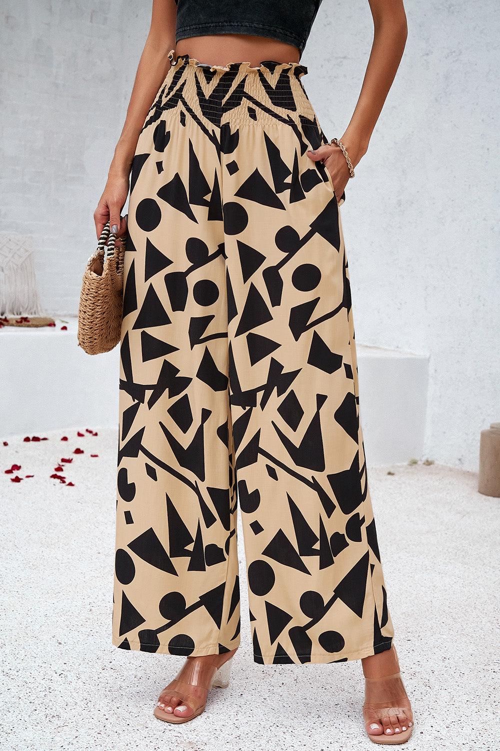 Pantalones anchos con bolsillos y estampado fruncido