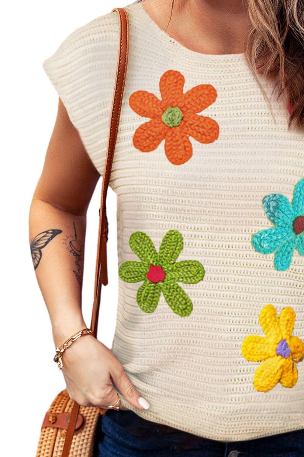 Blusa de punto con cuello redondo y mangas cortas con flores