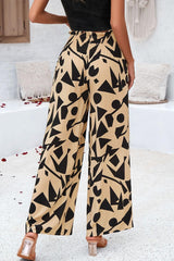 Pantalones anchos con bolsillos y estampado fruncido
