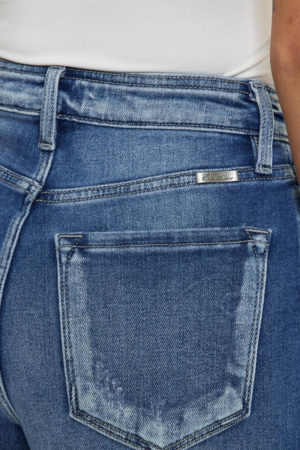 Pantalones cortos de mezclilla con dobladillo sin rematar y tiro alto con bragueta abotonada de Kancan