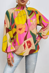 Blusa de cuello alto con mangas abullonadas y estampado floral