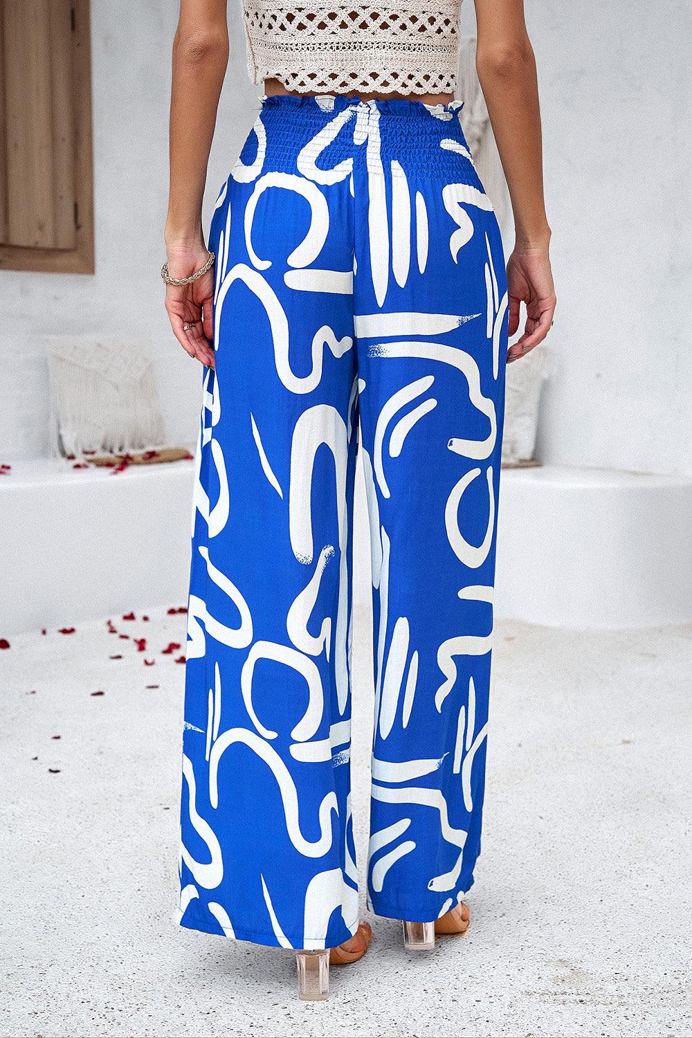 Pantalones anchos con bolsillos y estampado fruncido