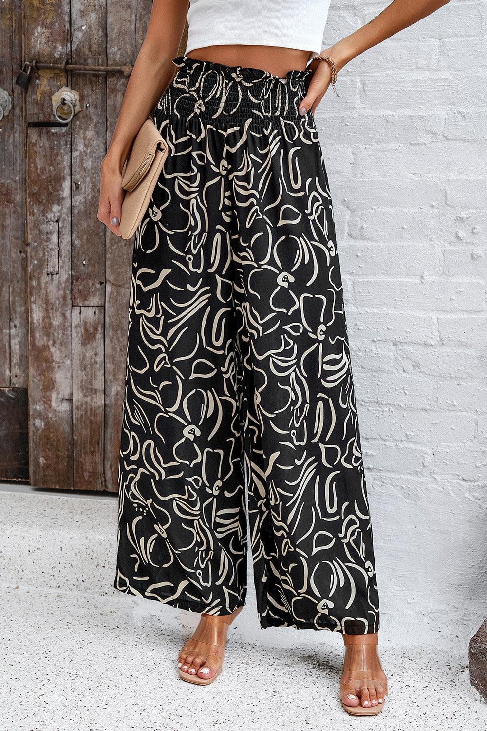 Pantalones anchos con bolsillos y estampado fruncido