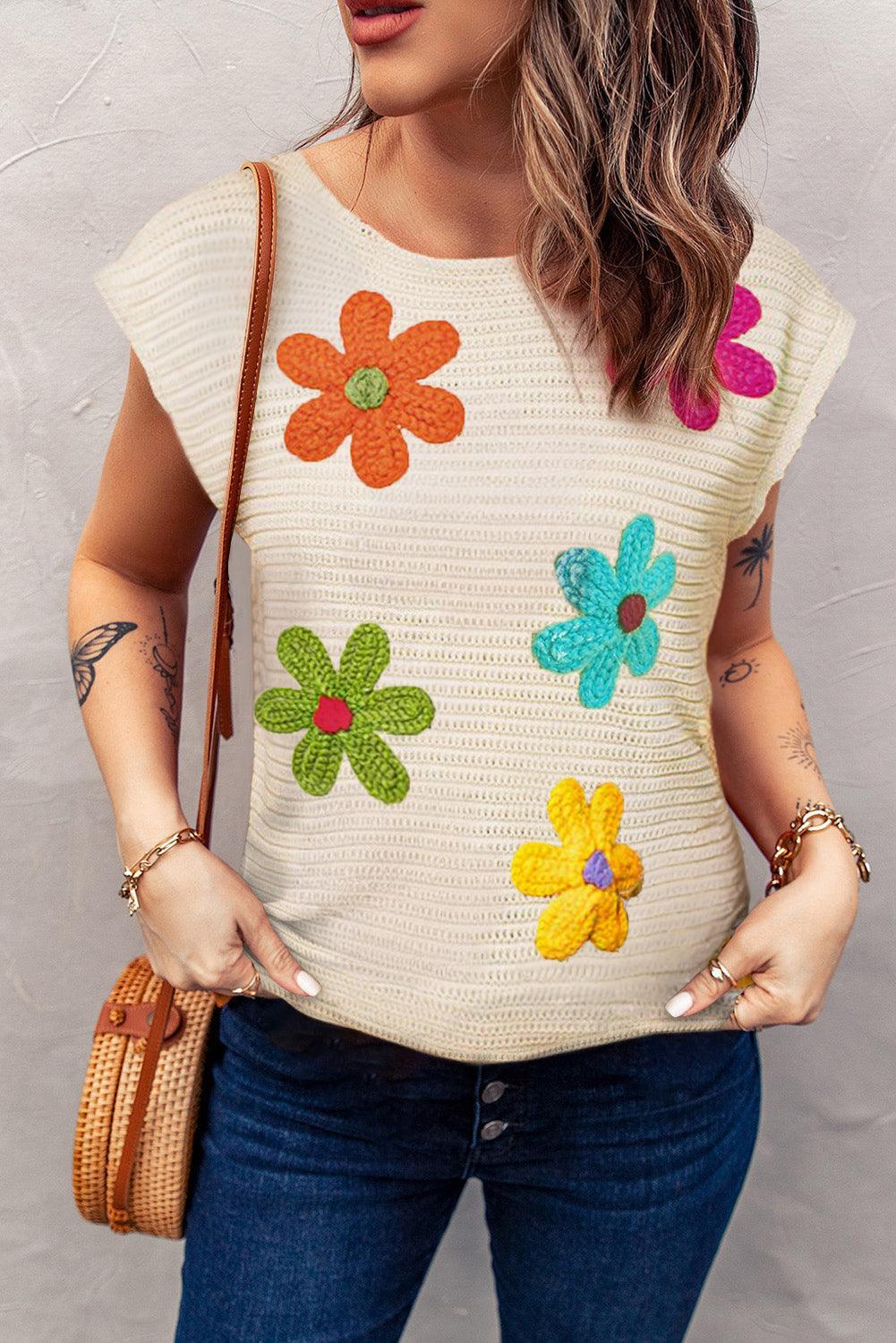 Blusa de punto con cuello redondo y mangas cortas con flores