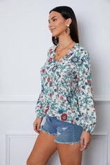 Blusa de manga larga con muescas y estampado floral