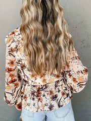 Blusa con mangas farol y estampado floral y cordón ajustable