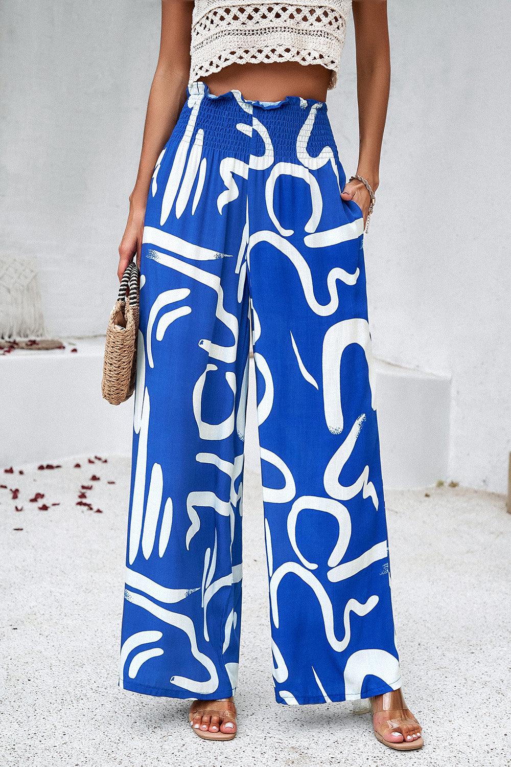 Pantalones anchos con bolsillos y estampado fruncido